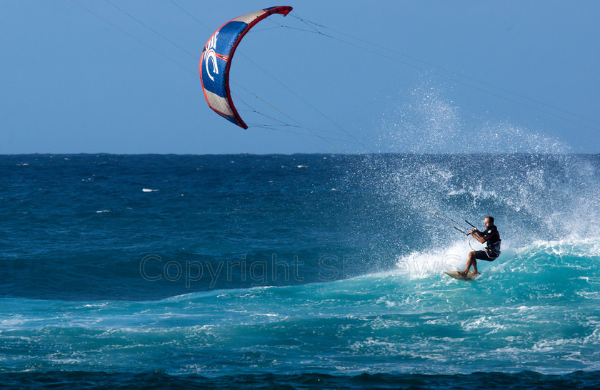 Windsurfers, Pupukea, Hawaii0769 
 Windfsurfers on Pacific Ocean waves at the end of Farrington Highway, near Dillingham Airfiled, Hawaii 
 Keywords: Windfsurfers, Pacific Coast, Farrington Highway, Near Dillingham Airfiled, Hawaii