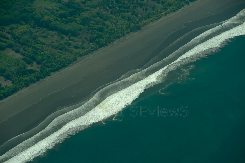 Pacific Coast Costa RicaDSC6180 
 Aerial view of Pacific Coast, Costa Rica 
 Keywords: Costa Rica, Pacific Coast, Aerial view, Beach, waves, black volcanic sand