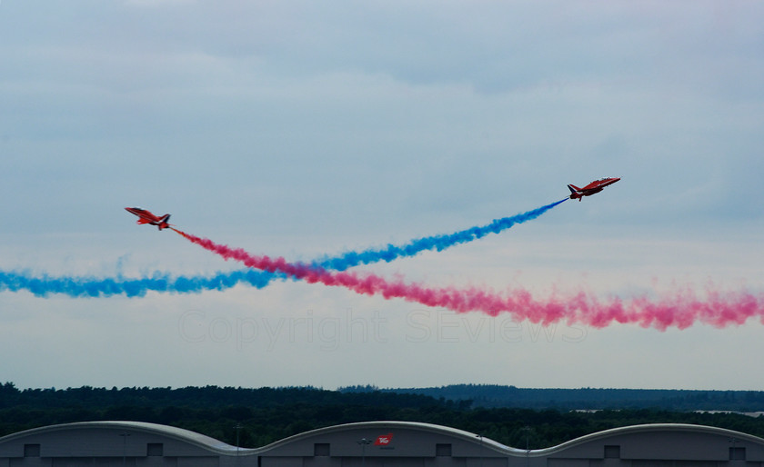 Red Arrows 0219 
 Red Arrows in action - head on then up and away 
 Keywords: Red Arrows, Farnborough airshow, July 2010