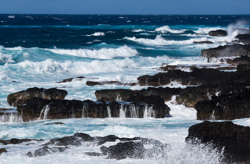 Rocky coastline Kaena Point Hawaii 
 Large waves on Pacific Ocean hitting rocky coastline at Kaena Point, Hawaii 
 Keywords: Large waves, Pacific Ocean, rocky coastline, Kaena Point, Hawaii