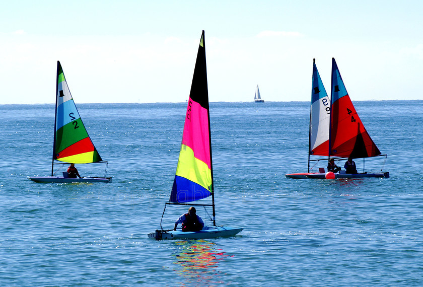 Yachts0088 
 KONICA MINOLTA DIGITAL CAMERA 
 Keywords: Sea, Sky, sunshine, sailing, colourful sails, dinghy, small sailing boat, Seaside, Littlehamton, West Sussex, UK, EU