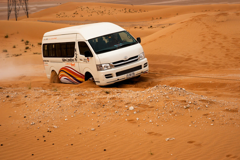 Al Ain balloon8732 
 Minibus being towed out of rut in desert near Al Ain, UAE 
 Keywords: Al Ain, desert, dunes, UAE