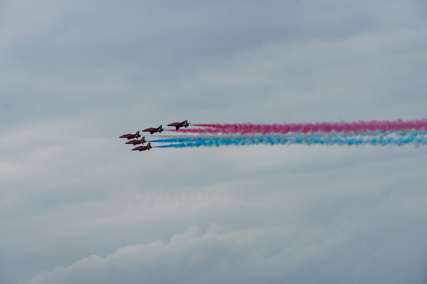 Red Arrows 0151 
 Red Arrows in action - heavy smoke trails, horizontal arrow 
 Keywords: Red Arrows, Farnborough airshow, July 2010