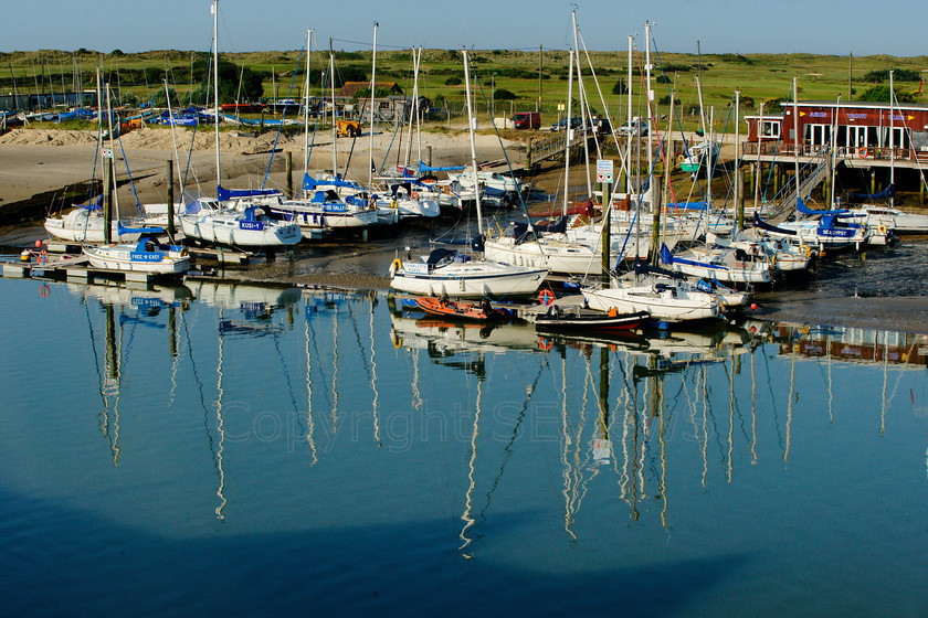 Arun River Reflections3395 
 SONY DSC 
 Keywords: Sea, Seaside, Boat, mast, reflections, River Arun, Arun Yacht Club, Littlehamton, West Sussex