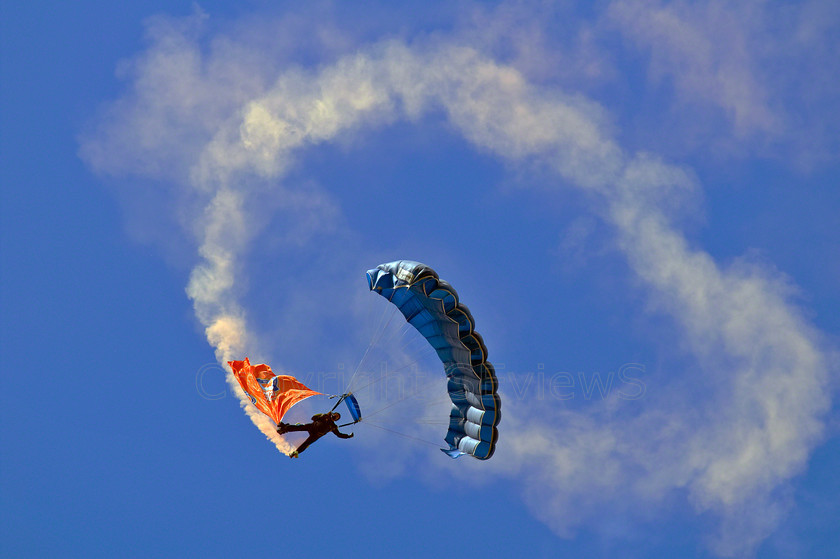 Paraglider Brands Hatch PICT0215 
 Paraglider flying in to Brands Hatch 
 Keywords: Brands Hatch: paraglider, smoke trail