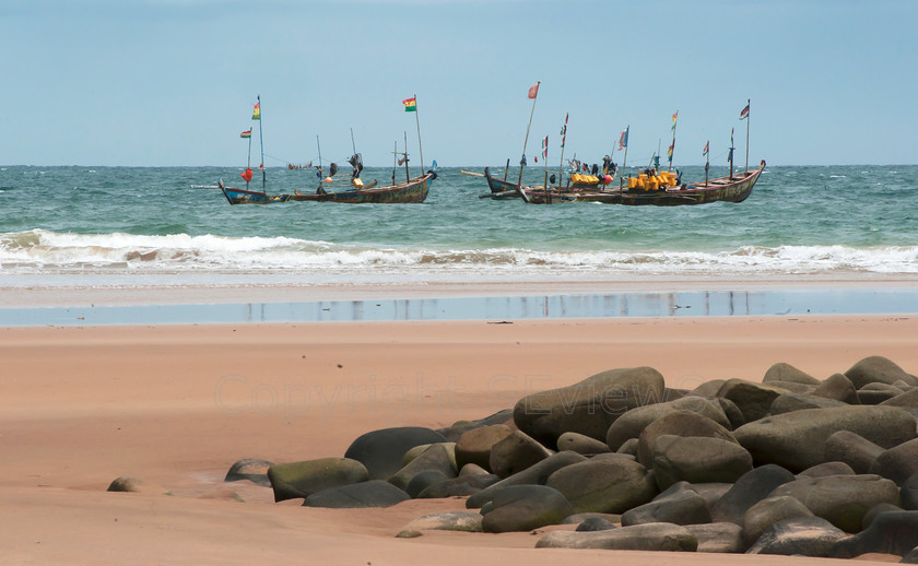 Wooden fishing boats 
 Wooden fishing boats anchored near beach, Busua, Ghana, West Africa 
 Keywords: Beach near Busua, Ghana, West Africa