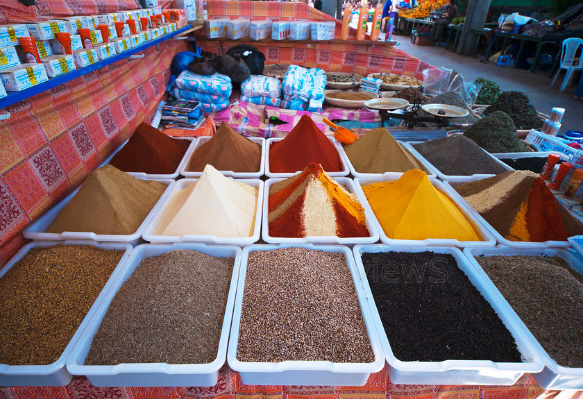 Colourful loose spices 
 Colourful loose spices piles in market stall, Agadir, Morocco 
 Keywords: Colourful, loose spices, market stall, Agadir, Morocco