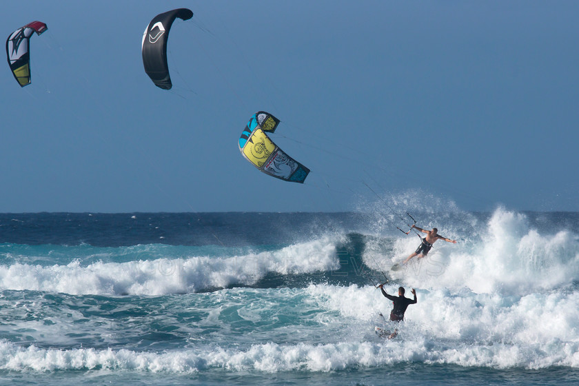 Windsurfers, Pupukea, Hawaii0831 
 Windfsurfers on Pacific Ocean waves at the end of Farrington Highway, near Dillingham Airfiled, Hawaii 
 Keywords: Windfsurfers, Pacific Coast, Farrington Highway, Near Dillingham Airfiled, Hawaii