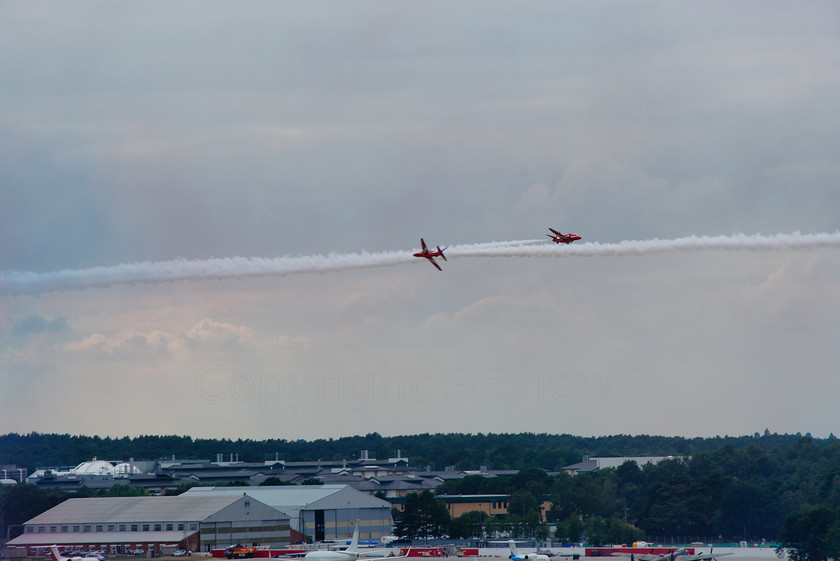 Red Arrows 0172 
 Red Arrows in action - two head on 
 Keywords: Red Arrows, Farnborough airshow, July 2010