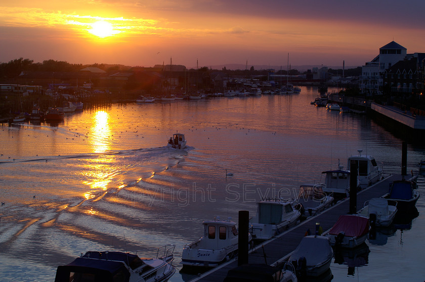 Littelhampton0100 
 Sunset over river Arun, Littlehamptopn, West Sussex 
 Keywords: Sunset, Sea, Seaside, Boat, mast, reflections, River Arun, Littlehamton, West Sussex, Arun River, Littlehampton, UK