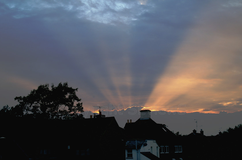 Sunset20002copy 
 KONICA MINOLTA DIGITAL CAMERA 
 Keywords: Sunset, Silhouette, sunbeams out of chimney, Sky, Camberley, Surrey, UK, EU