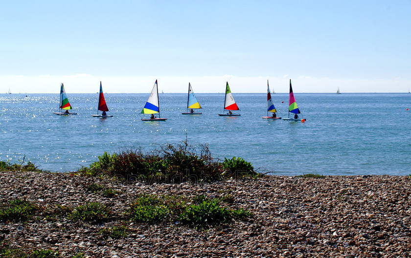 Yachts0075 
 KONICA MINOLTA DIGITAL CAMERA 
 Keywords: Sea, Sky, sunshine, sailing, colourful sails, dinghy, small sailing boat, Seaside, Littlehamton, West Sussex, UK, EU